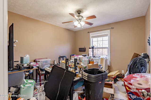 home office with ceiling fan and a textured ceiling