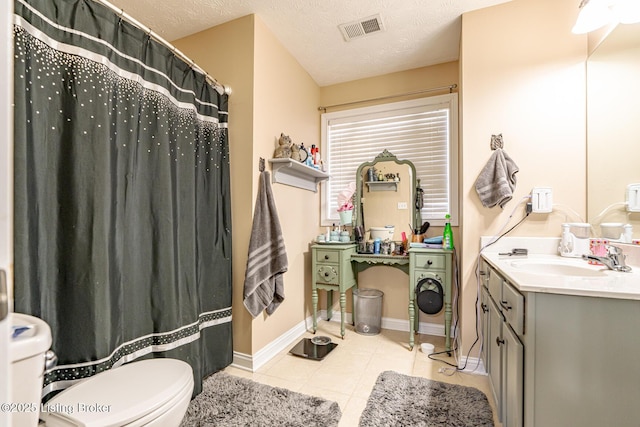 full bath with visible vents, toilet, a textured ceiling, vanity, and tile patterned floors