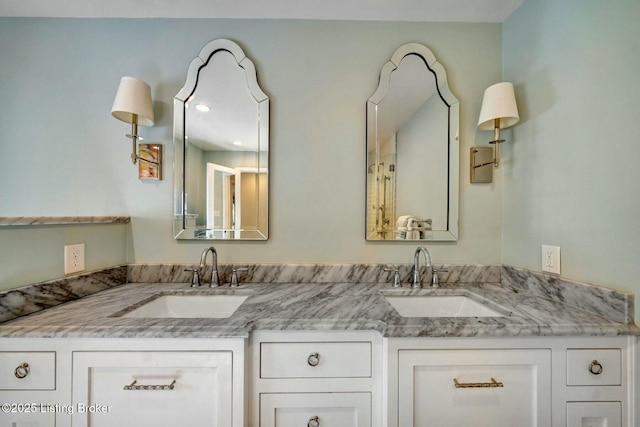 bathroom featuring double vanity and a sink