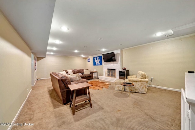 living area with light carpet, a brick fireplace, baseboards, and crown molding