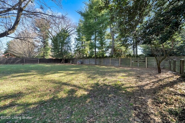 view of yard with a fenced backyard