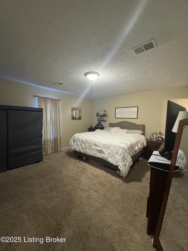 carpeted bedroom featuring visible vents