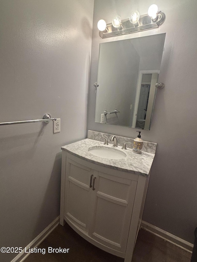 bathroom featuring vanity and baseboards