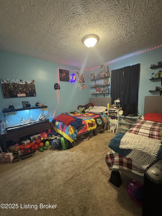 bedroom with carpet and a textured ceiling