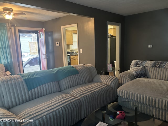 living room featuring ceiling fan