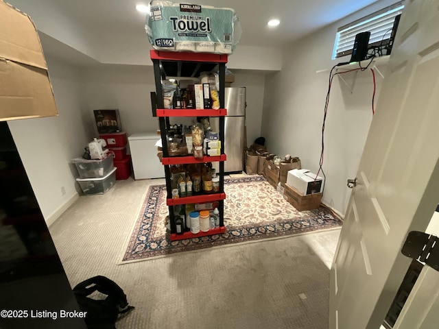 interior space featuring carpet floors, refrigerator, recessed lighting, freestanding refrigerator, and baseboards