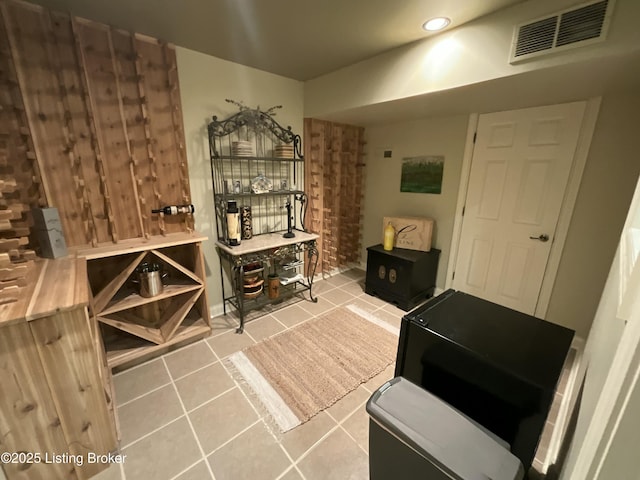 wine cellar featuring visible vents and tile patterned floors