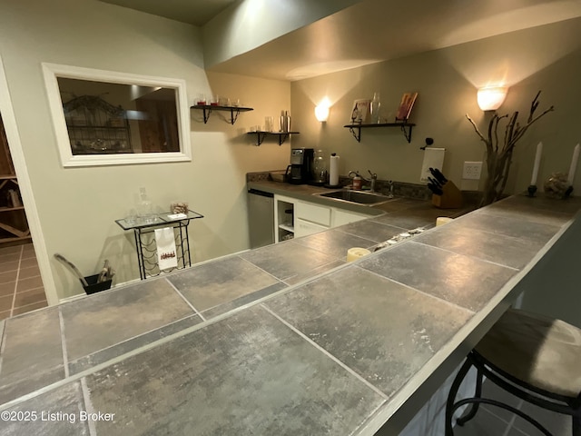 bar featuring indoor wet bar and a sink