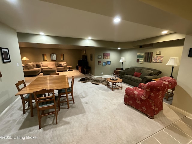 living room featuring baseboards and recessed lighting