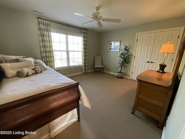 carpeted bedroom with a closet, visible vents, ceiling fan, and baseboards