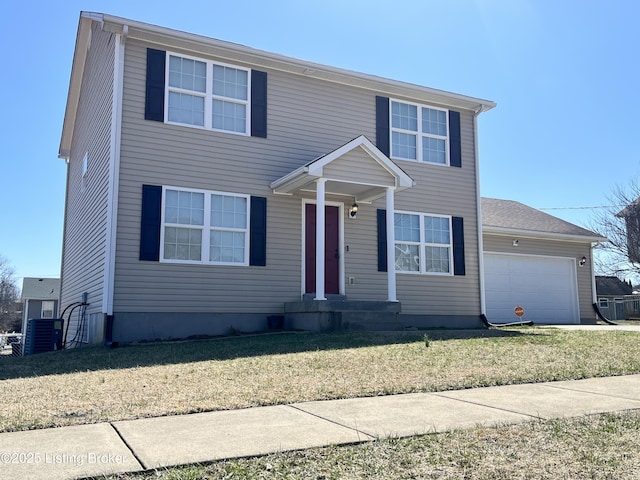 view of front of home featuring a garage and a front yard