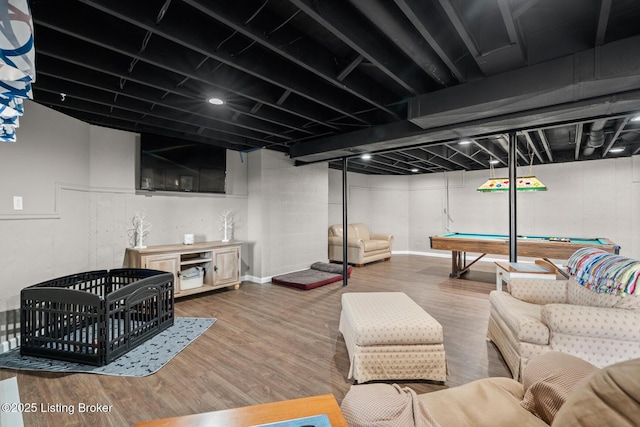 living room featuring billiards and wood finished floors