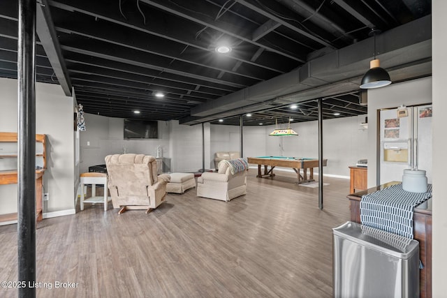 finished basement with pool table, wood finished floors, and baseboards