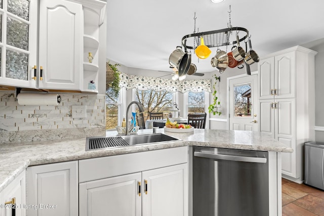 kitchen featuring open shelves, a sink, white cabinets, stainless steel dishwasher, and tasteful backsplash