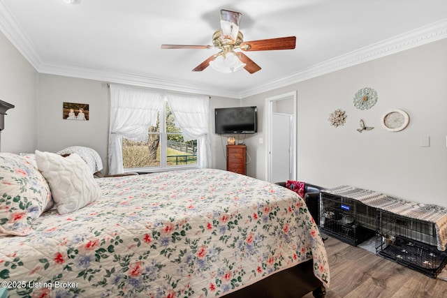 bedroom featuring a ceiling fan, crown molding, and wood finished floors