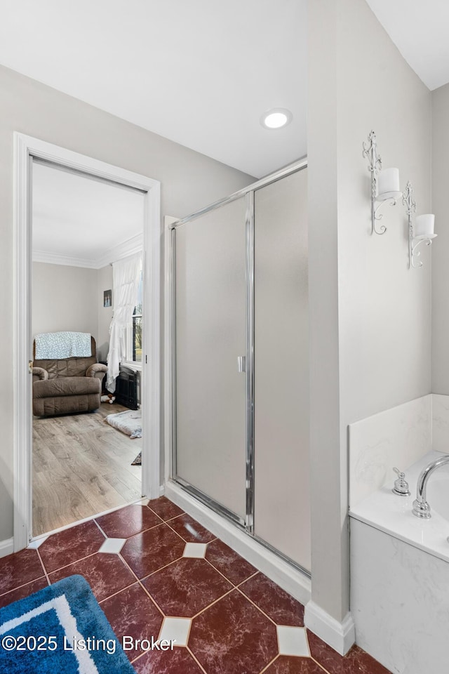 ensuite bathroom featuring a shower stall, a bath, tile patterned floors, and connected bathroom