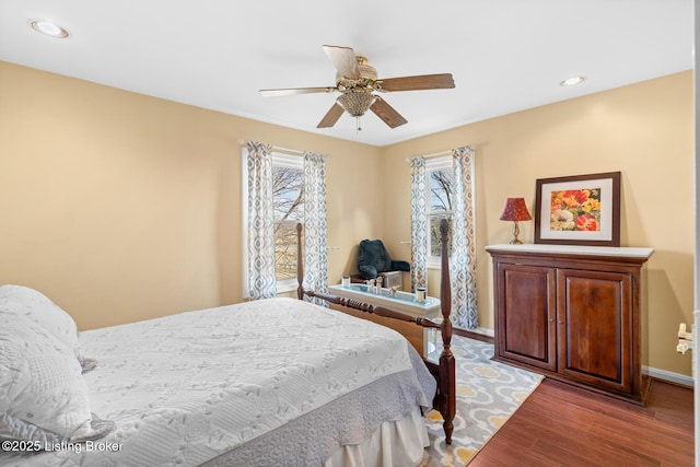 bedroom with recessed lighting, baseboards, wood finished floors, and a ceiling fan