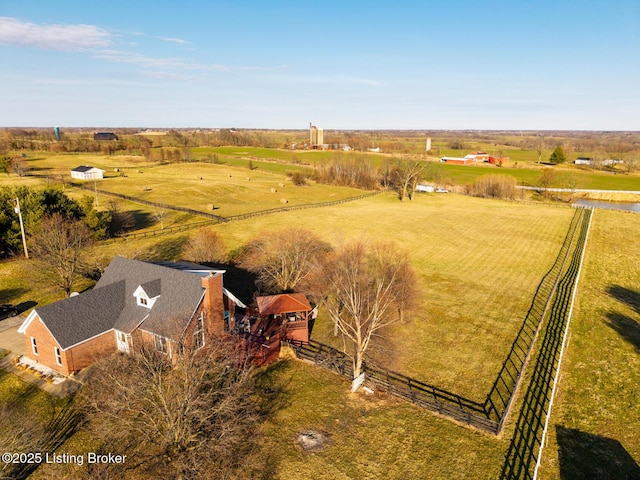 birds eye view of property with a rural view