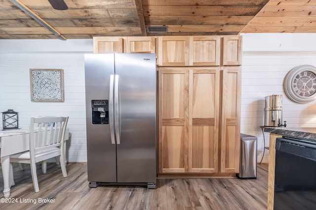 kitchen featuring wood ceiling, light wood-type flooring, wood walls, light brown cabinets, and stainless steel refrigerator with ice dispenser