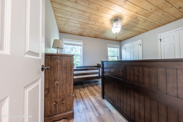 bedroom featuring wooden ceiling and wood finished floors