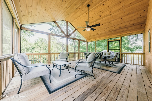 sunroom / solarium featuring wooden ceiling, vaulted ceiling, and a ceiling fan