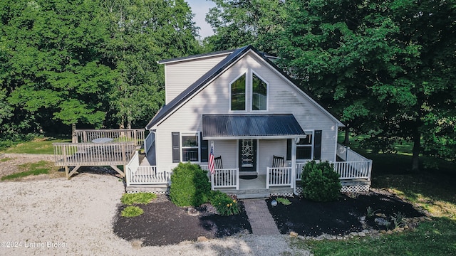 view of front of property featuring covered porch and metal roof