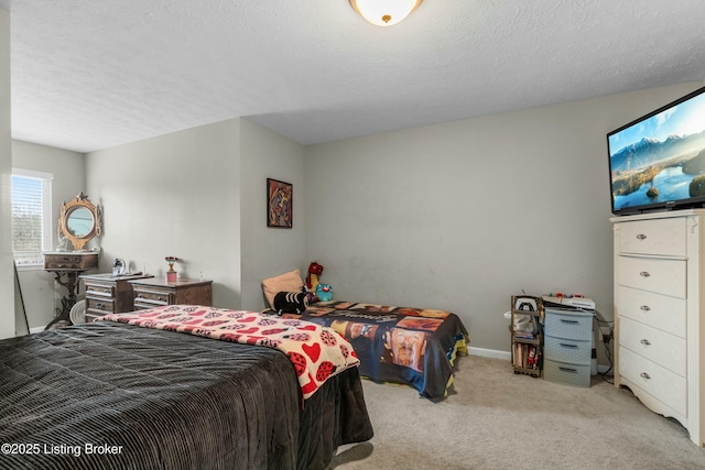 bedroom featuring a textured ceiling, baseboards, and light colored carpet