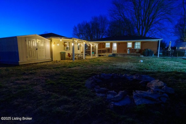 view of back of house at night