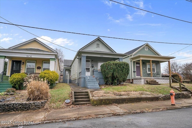 shotgun-style home featuring a porch