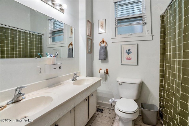 full bathroom featuring tile patterned flooring, a sink, toilet, and double vanity