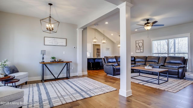 living area with decorative columns, recessed lighting, a ceiling fan, wood finished floors, and baseboards