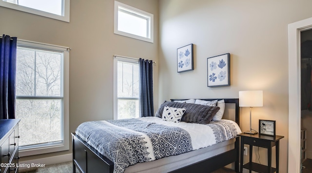 bedroom featuring multiple windows