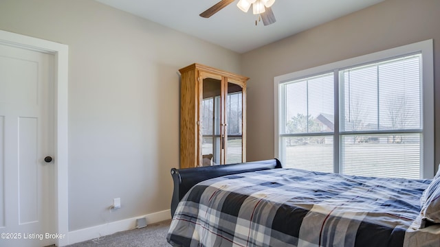 carpeted bedroom with baseboards