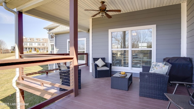 wooden terrace with a ceiling fan