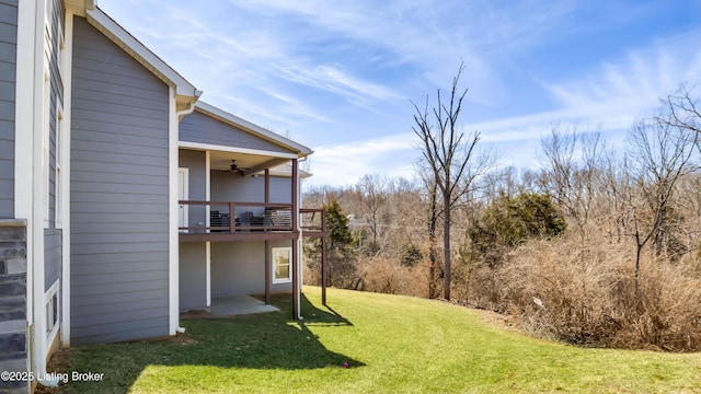 view of yard featuring a ceiling fan