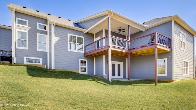 back of house featuring french doors, a patio area, a lawn, and ceiling fan