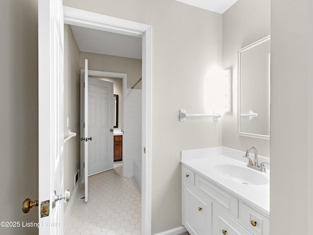 bathroom with tile patterned flooring, visible vents, and vanity