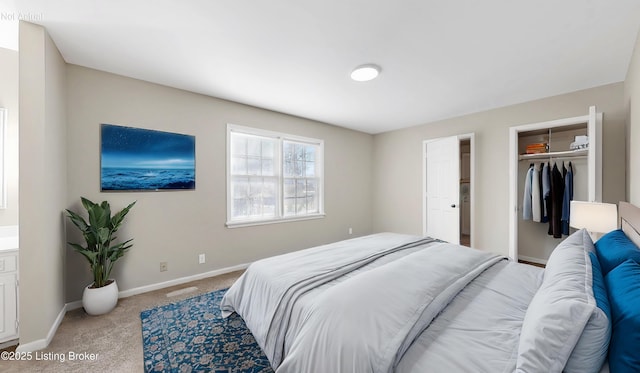 carpeted bedroom with baseboards and a closet