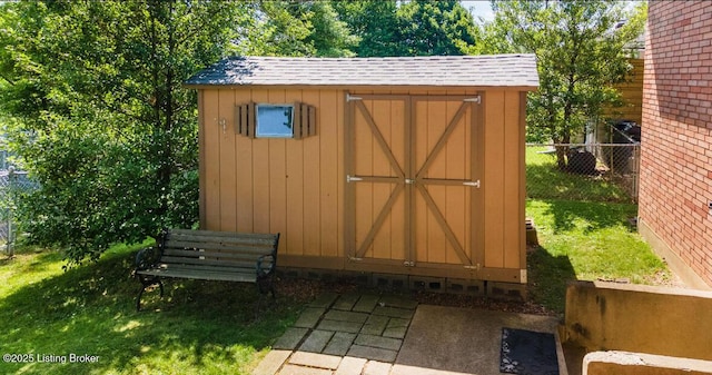 view of shed with fence