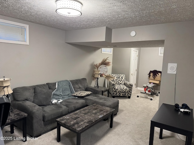 carpeted living room featuring a textured ceiling