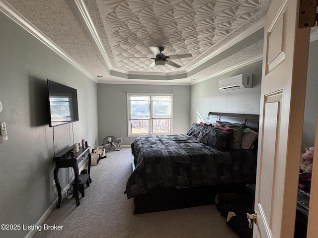 carpeted bedroom with a ceiling fan, baseboards, an AC wall unit, a raised ceiling, and crown molding