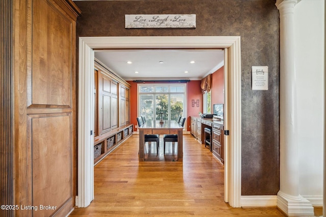 dining area featuring recessed lighting, light wood-type flooring, decorative columns, and crown molding