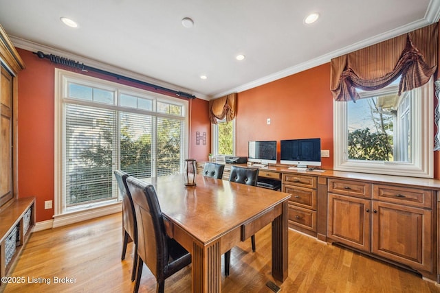 dining area featuring baseboards, ornamental molding, recessed lighting, and light wood-style floors