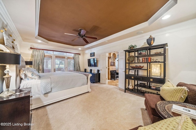 bedroom featuring arched walkways, recessed lighting, carpet flooring, a ceiling fan, and a raised ceiling