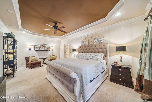 carpeted bedroom with recessed lighting, a ceiling fan, baseboards, ornamental molding, and a raised ceiling