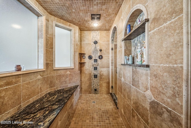 bathroom with tiled shower