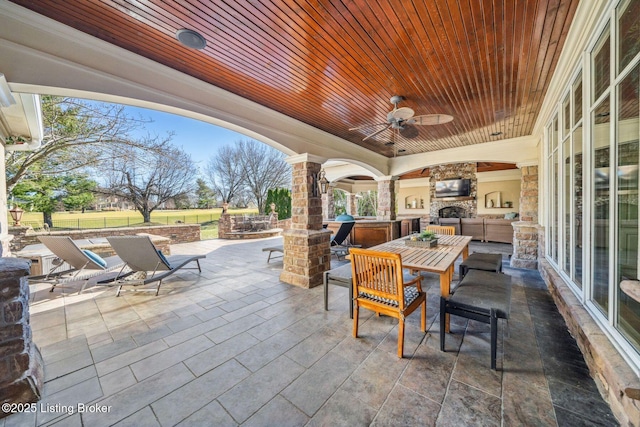 view of patio / terrace featuring outdoor dining area, ceiling fan, and area for grilling