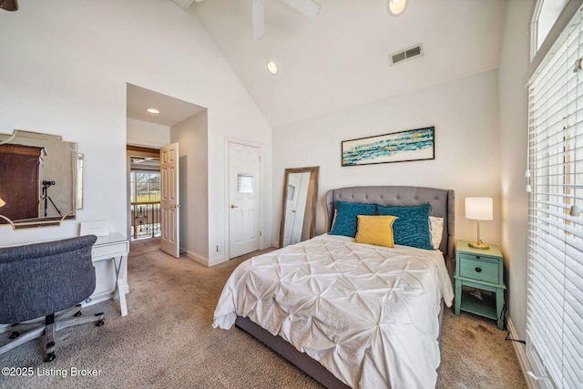 carpeted bedroom featuring high vaulted ceiling, baseboards, and visible vents