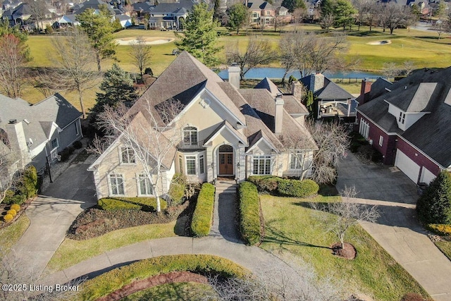 bird's eye view with a residential view and a water view