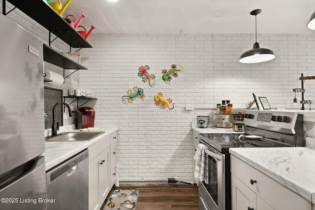 kitchen with stainless steel appliances, a sink, white cabinets, dark wood-style floors, and open shelves